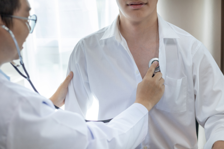 Doctor listening to breathing