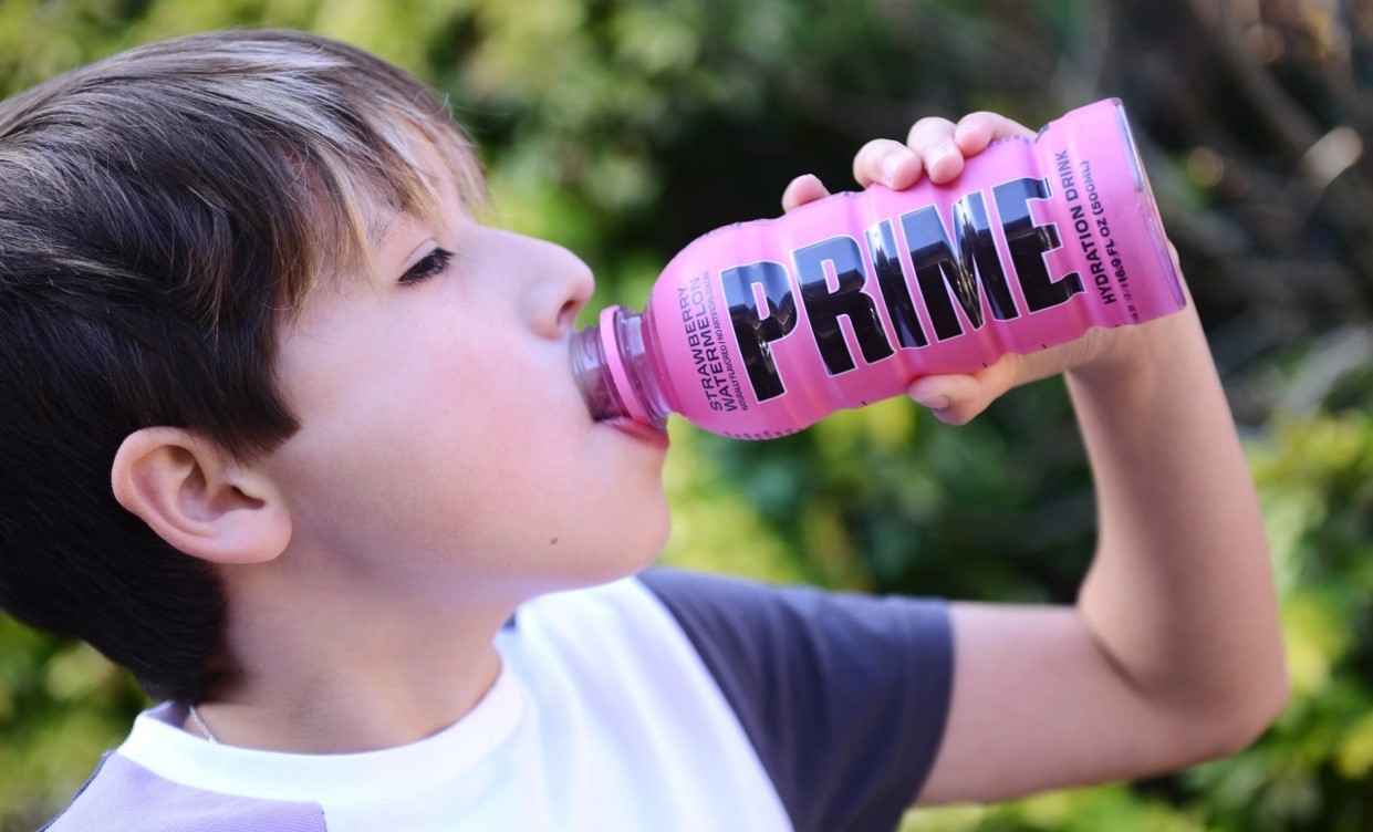 Child drinking Prime Hydration drink